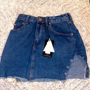 Pretty Little Thing denim skirt with chains on the side. New with tags